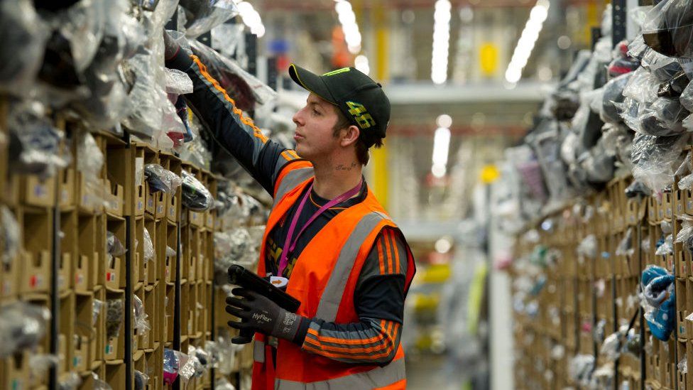 An Amazon worker at a warehouse in Swansea, Wales