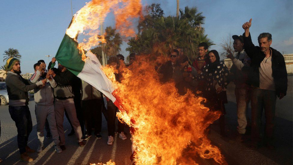 Libyan demonstrators in Benghazi burn an Italian flag during a protest against Italy for their alleged support to a Misrata armed group - Sunday 12 February 2017