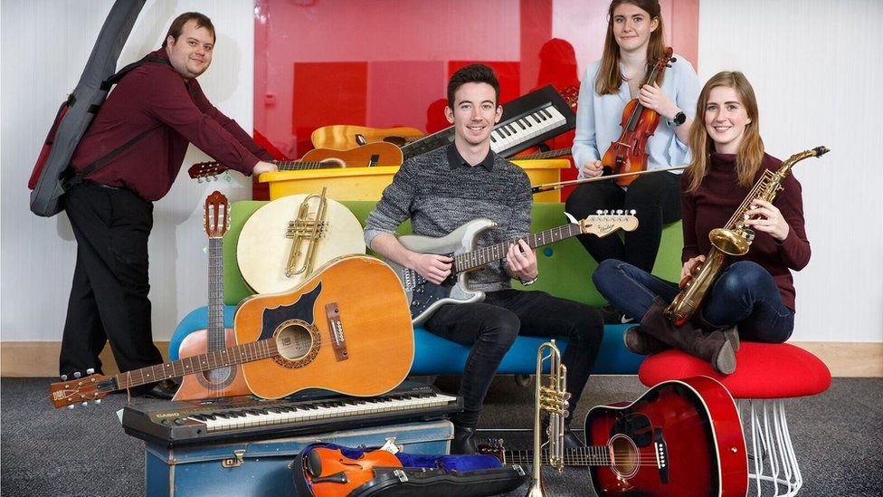 Royal Welsh College of Music and Drama students inspect donated instruments