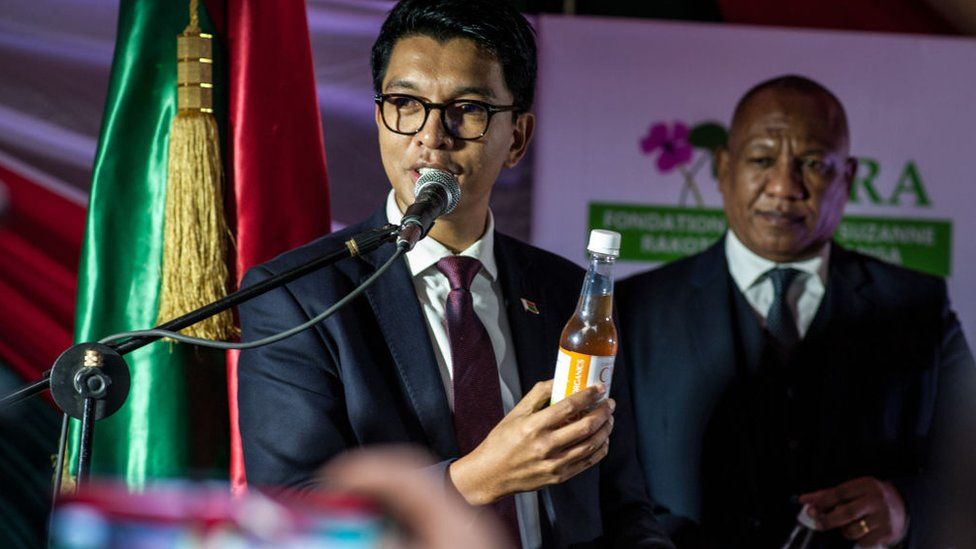 President of Madagascar Andry Rajoelina shows a "Covid Organics", a herbal medicine, which allegedly being developed against coronavirus (Covid-19), during a press conference in Antananarivo, Madagascar on April 20, 2020.