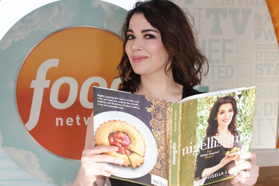Nigella Lawson with one of her multiple cook books