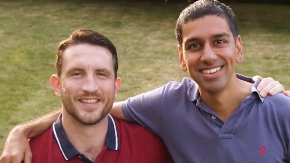 Jeff Leigh-Jones and Jai Singh, photographed smiling with their arms round each other