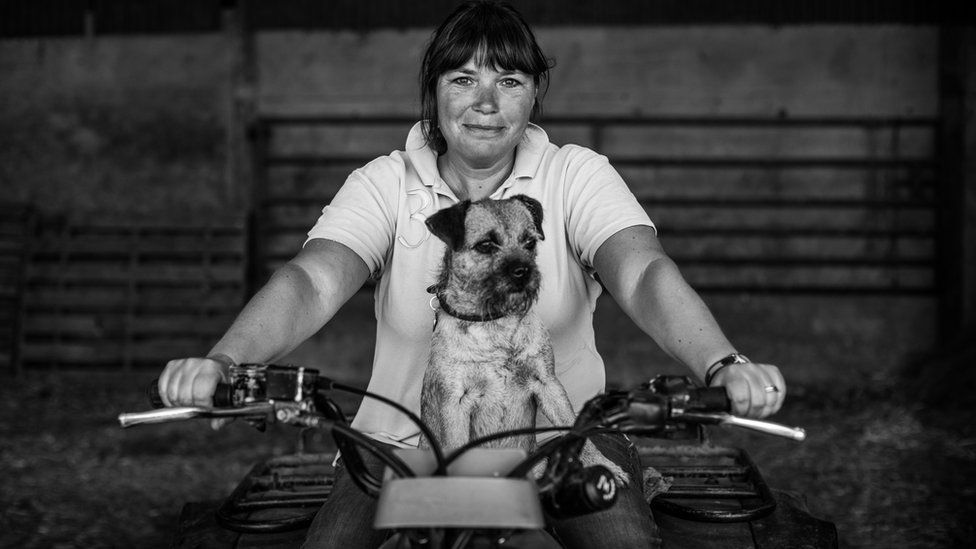 Billie Jones of Home Farm, Middlewood, on her quad bike with her dog Molly