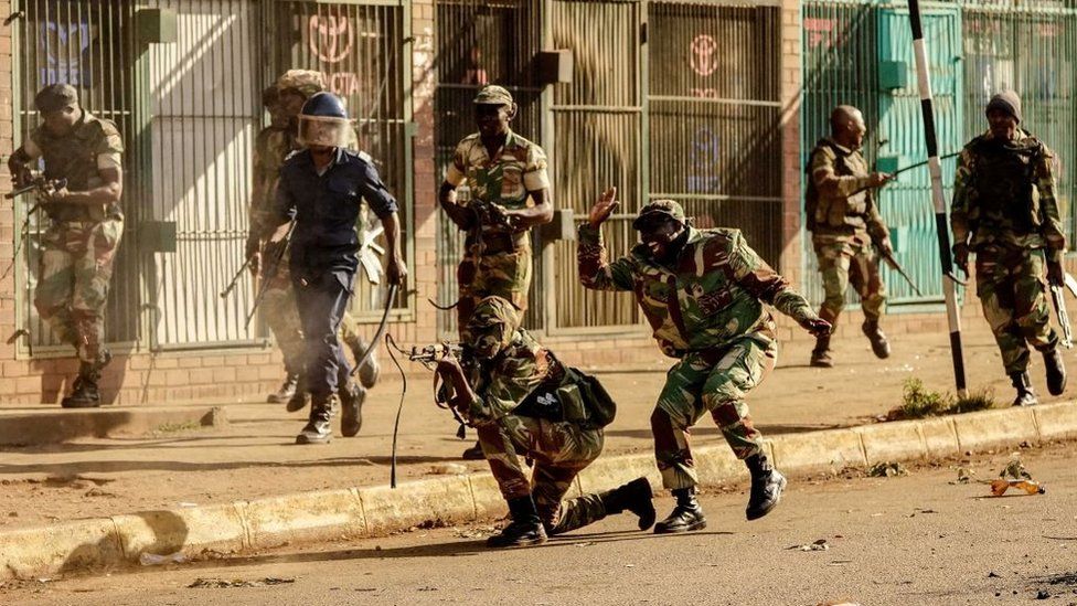 A soldier fires shots towards demonstrators, on August 1 2018, in Harare, as protests erupted over alleged fraud in the country's election.