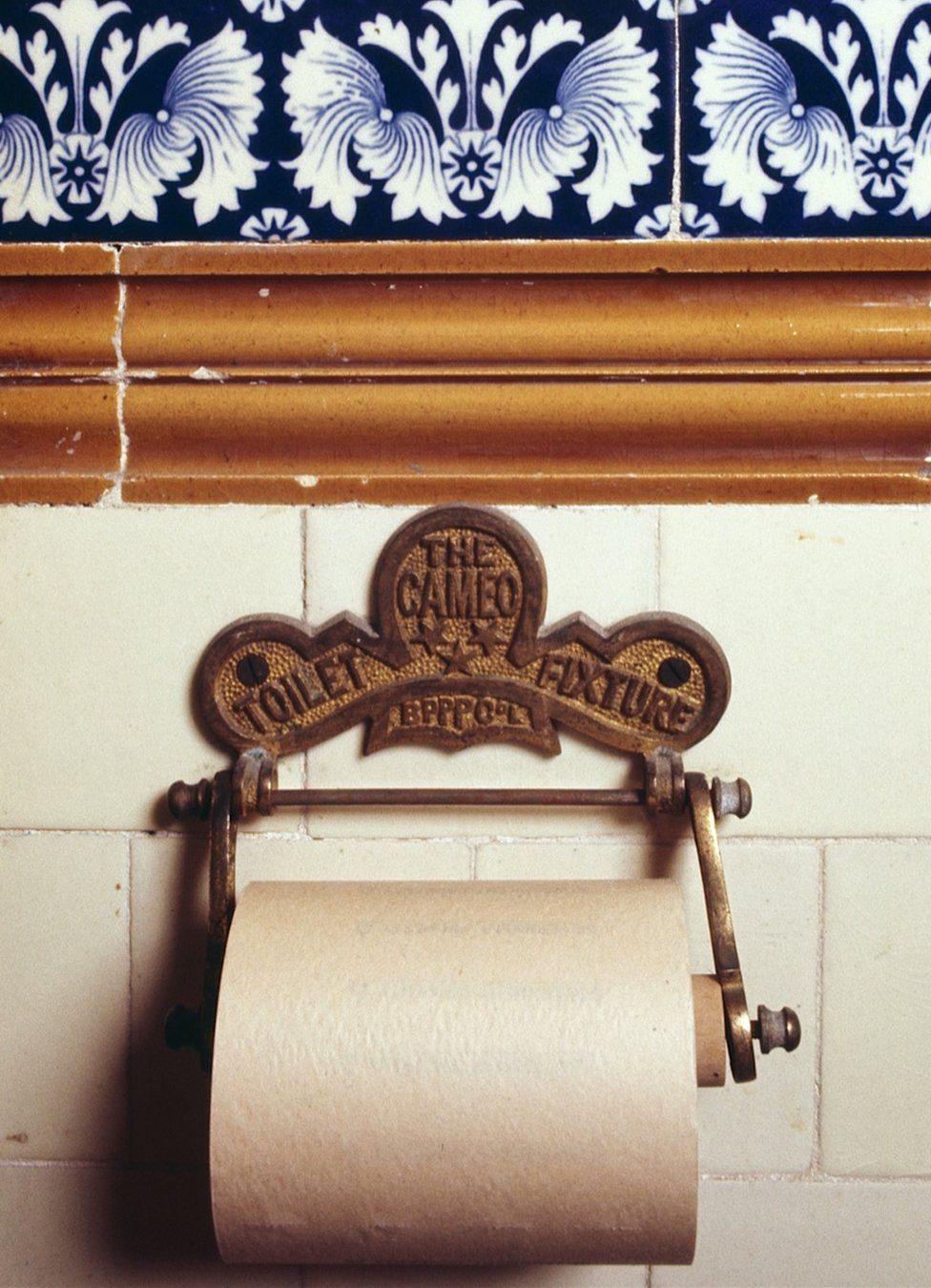 An early toilet roll holder designed by the British Perforated Paper Company