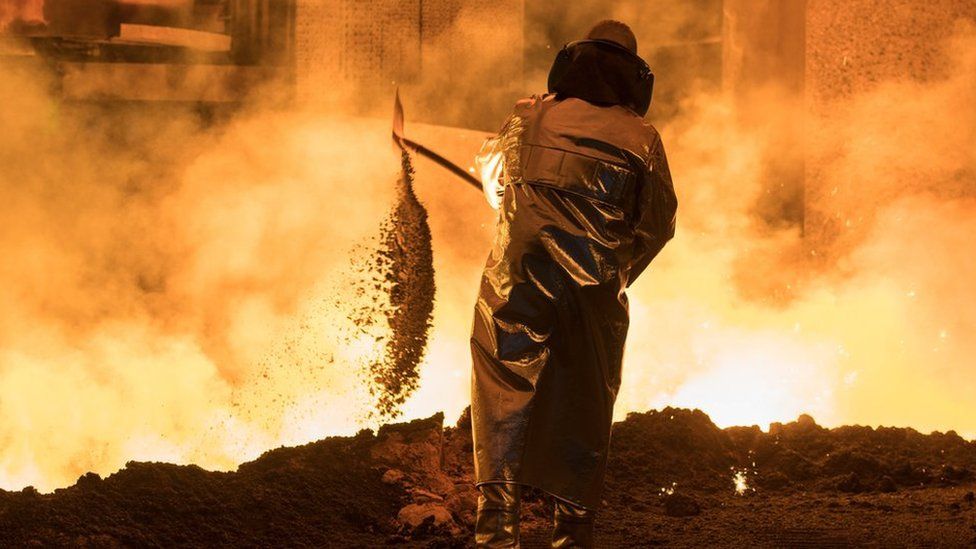 A Steel worker is seen at the blast furnace of German steel manufacturer Salzgitter AG in Salzgitter, Germany