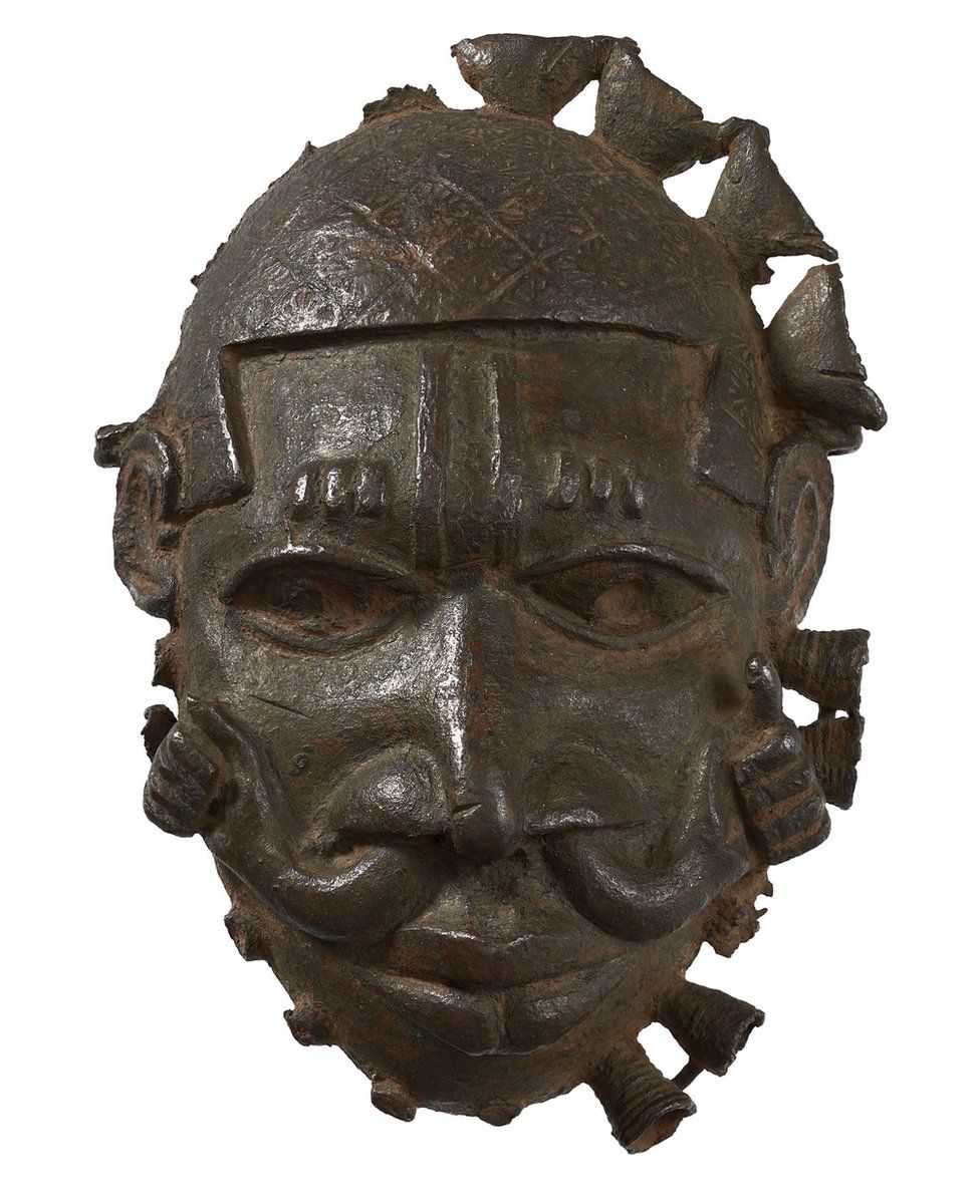 A brass face or mask