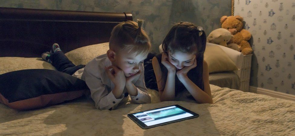 Children watching iPad