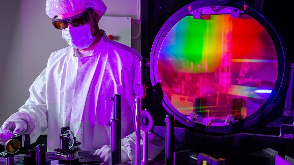 NIF scientists works on laser optics