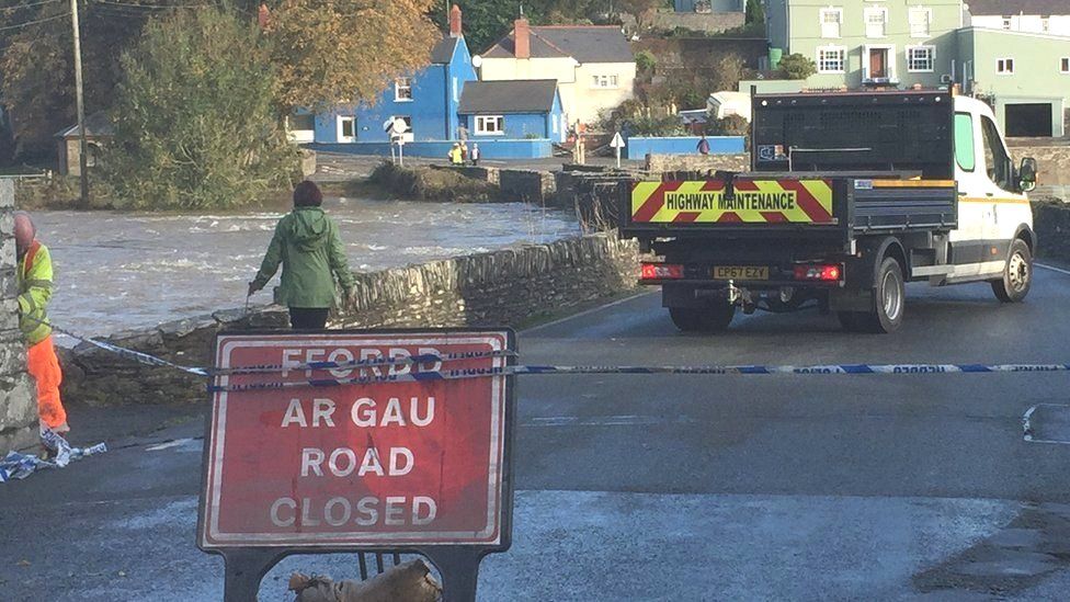 Sign and cordon across the road blocks access to Llechryd Bridge