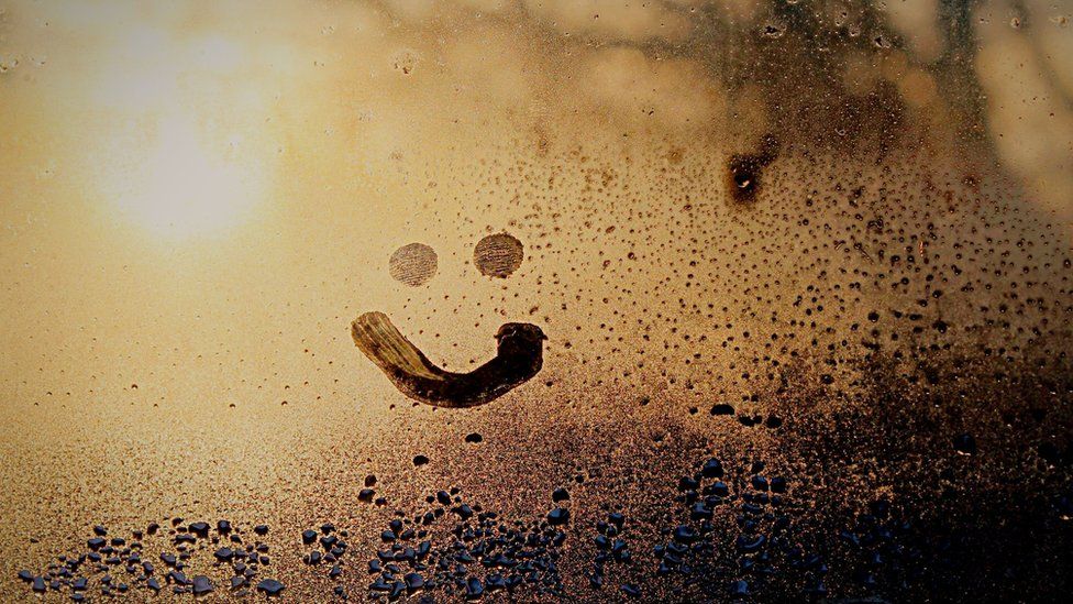 Smiley face on window