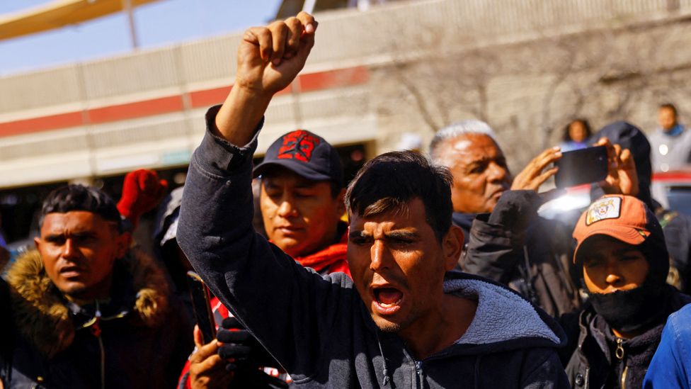 People protest outside the National Institute of Migration building after a fire broke out late on Monday at a migrant detention center, in Ciudad Juarez, Mexico, March 28, 2023.