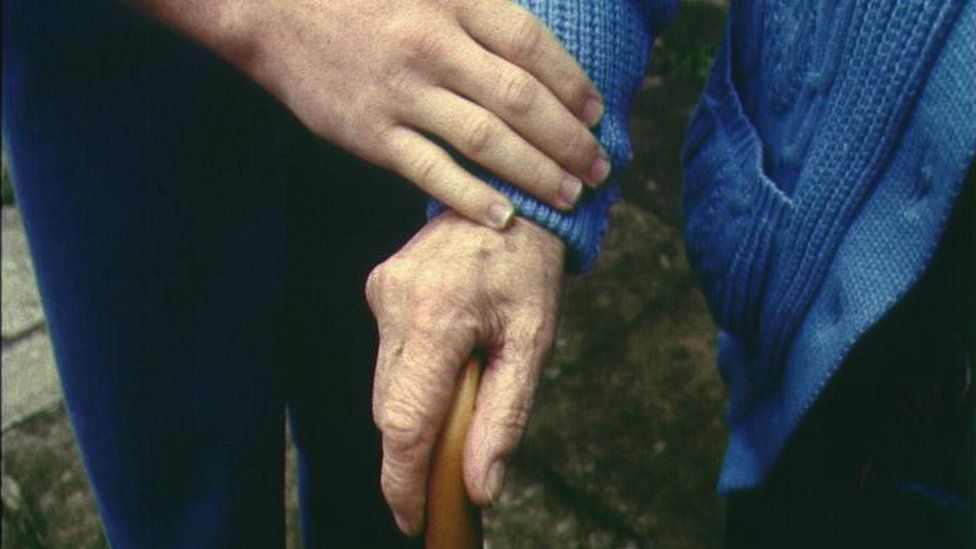 Elderly person with carer