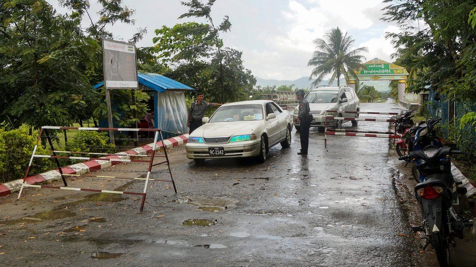 Police inspect cars at an entry point after deadly attacks near Maungdaw town on the Bangladesh-Myanmar border