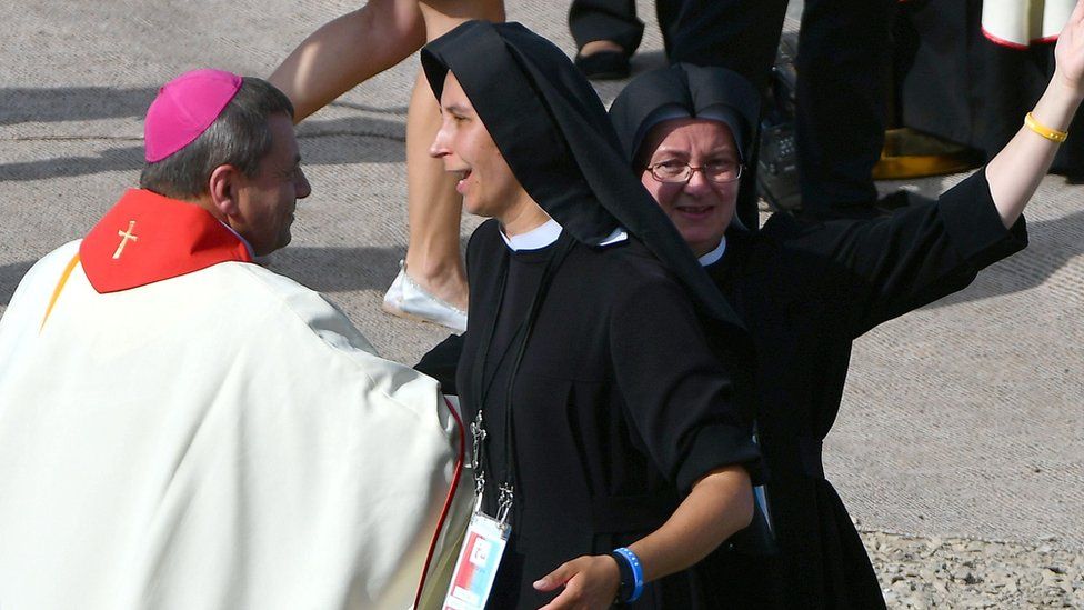 Nuns and clergy dancing to celebrate the arrival of Pope Francis - 31 July