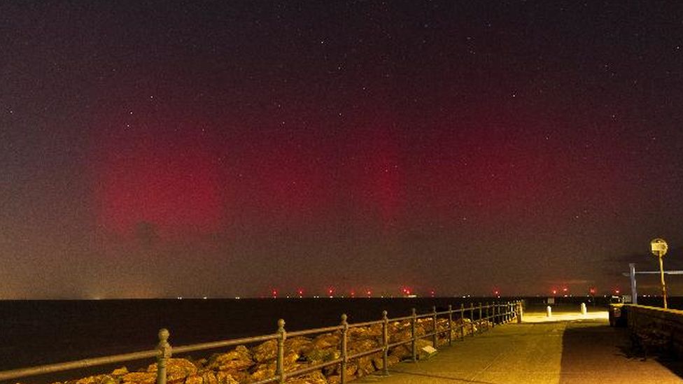 Glow of red above Herne Bay in Kent in the night sky.
