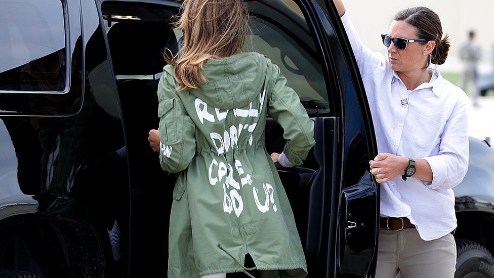 Melania Trump leaves airforce base in jacket (pictured stepping into car)