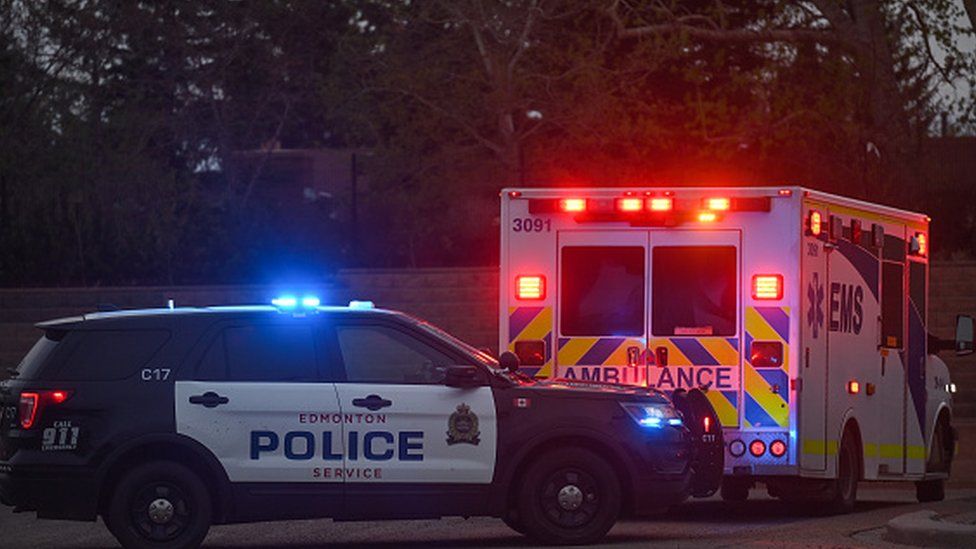 Stock image of police car and ambulance in Canada