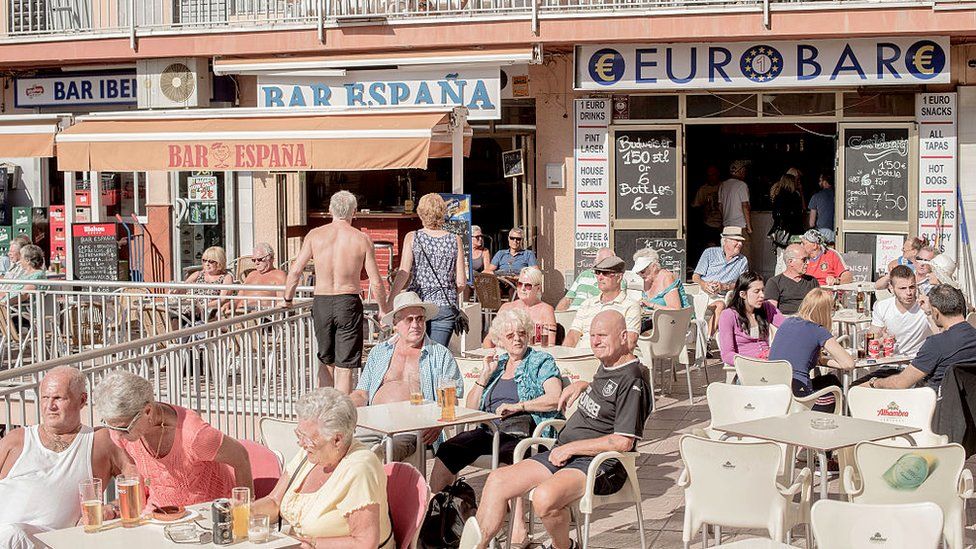 British expats and tourists at outdoor bars in Bonanza's square in Benalmadena, Spain