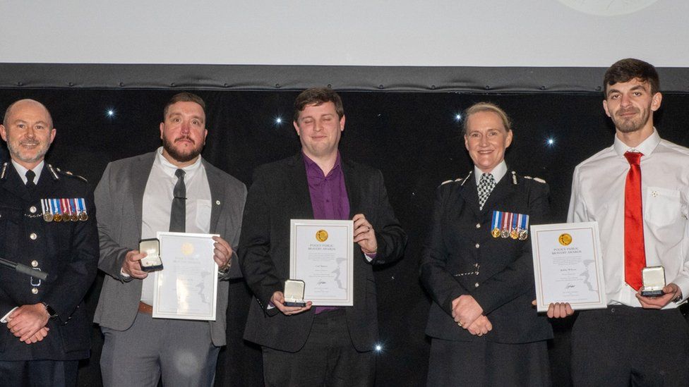 Carl Baines, Liam Fennelly and Bobby Wilcox, with Chief Constable of the NPCC Gavin Stephens and Chief Constable of Merseyside Police Serena Kennedy