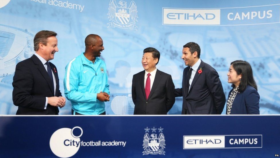 Head coach Patrick Vieira, Chinese President Xi Jinping and Manchester City Chairman Khaldoon Al Mubarack during a visit to the City Football Academy in Manchester