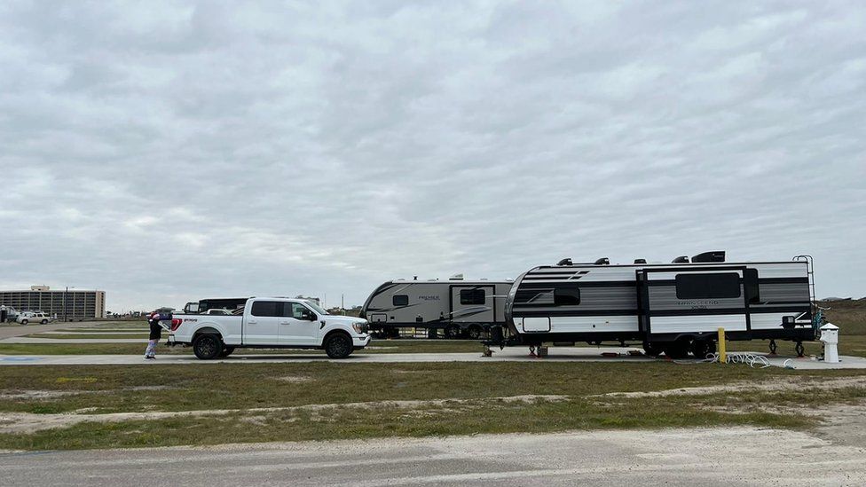 Annick Ruedi's RV trailer parked near an overcast Mustang Island beach.
