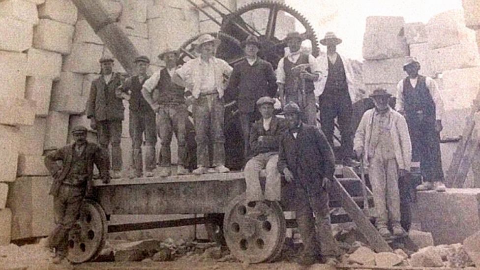 Workers near a similar crane