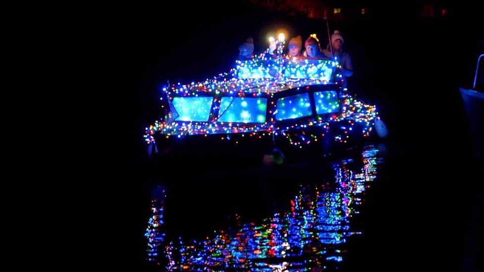 Illuminated boat on Grand Union Canal, Milton Keynes