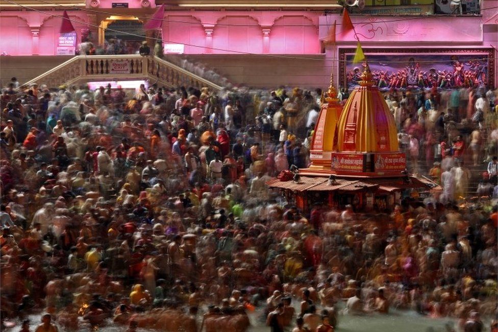 Hindu devotees take a holy dip in the Ganges river during Shahi Snan at "Kumbh Mela", or the Pitcher Festival, amidst the spread of the coronavirus disease (COVID-19), in Haridwar, India, April 14, 2021.