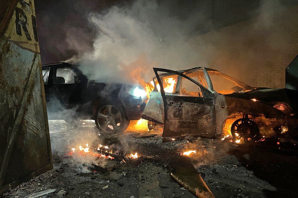 Burning cars on a street in west Belfast