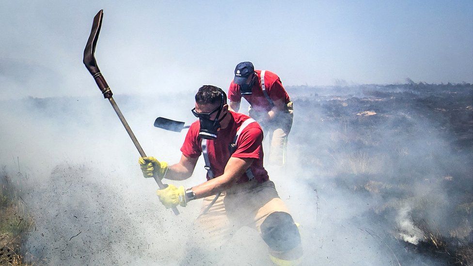 Firefighters tackling the fire at Winter Hill