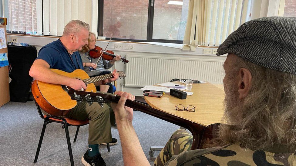 A music therapy session at the service