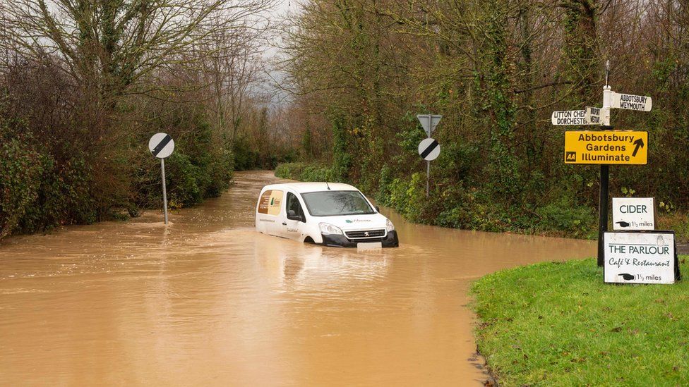 Dorset flood warnings as heavy rain forecast - BBC News