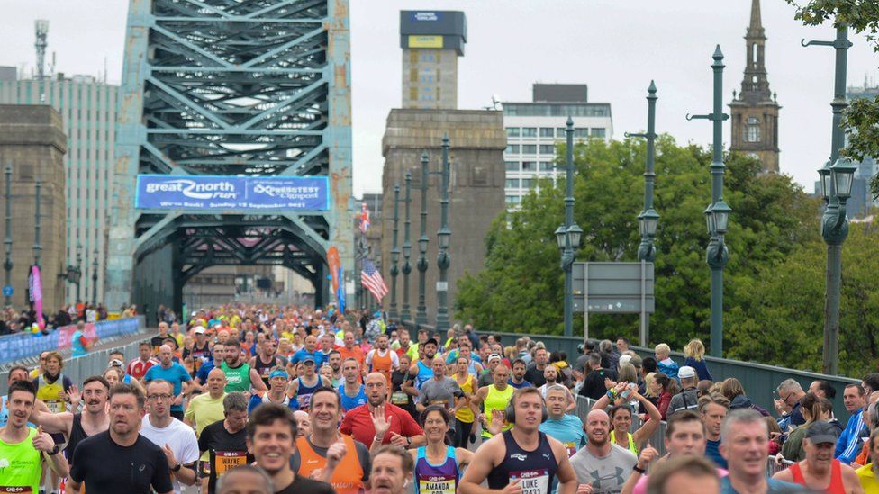 Thousands of runners stream across the Tyne Bridge