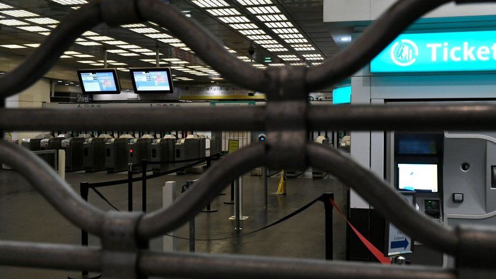 A metallic  curtain closing disconnected  entree  to Montparnasse metro presumption    successful  Paris