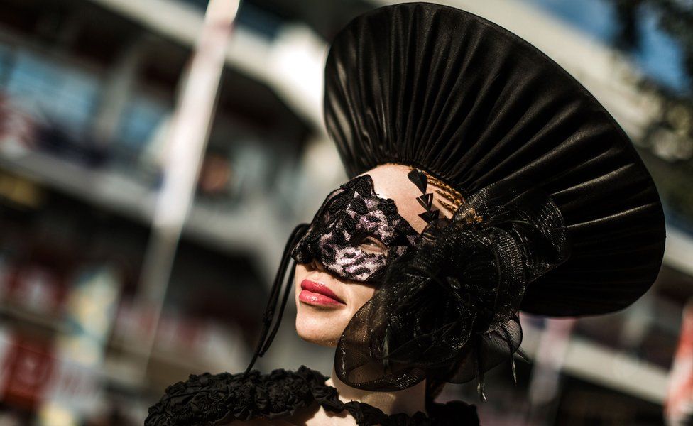 An albino model in a black hat the Durban July race event, Durban , South Africa - Friday 6 July 2018