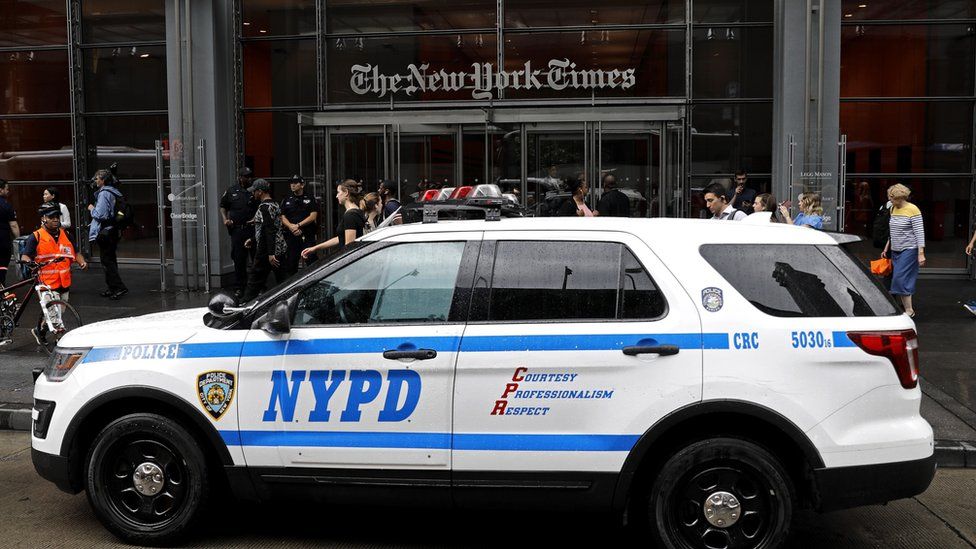 police in front of the New York Times