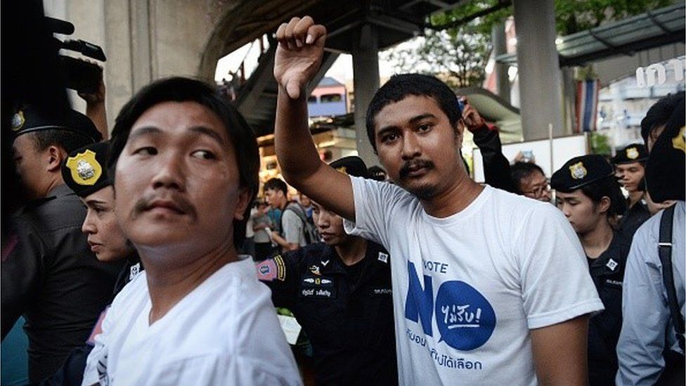 Thai election authorities on Wednesday filed their first charge under a law banning campaigning and debate before a referendum on a controversial new constitution, as the junta tightens its grip on free speech.