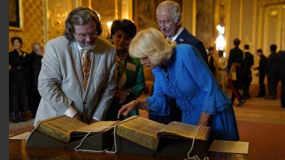 Queen Camilla looks at the second Shakespeare Folio