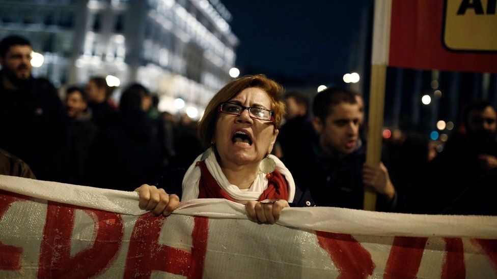 A protester shouts slogans during a rally against new reforms planned by the government in Athens, Greece on 15 January