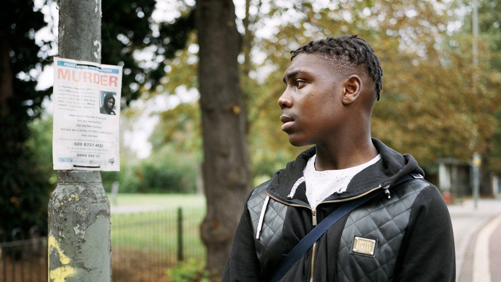 Jhemar with a poster featuring Michael's death