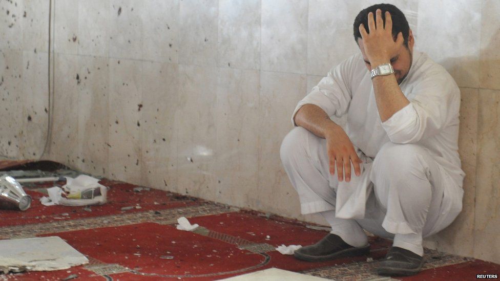 Mourner after bombing at Shia mosque in Saudi Arabia