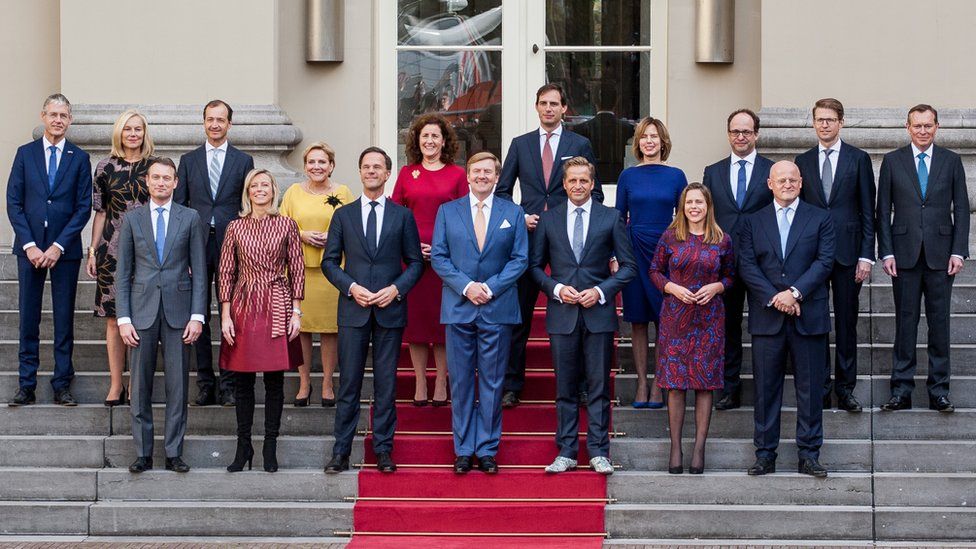 The new ministers and state secretaries of the cabinet Rutte III pose for a group photo with King Willem-Alexander (C) and Prime Minister Mark Rutte at Palace Noordeinde in The Hague, Netherlands on October 26, 2017