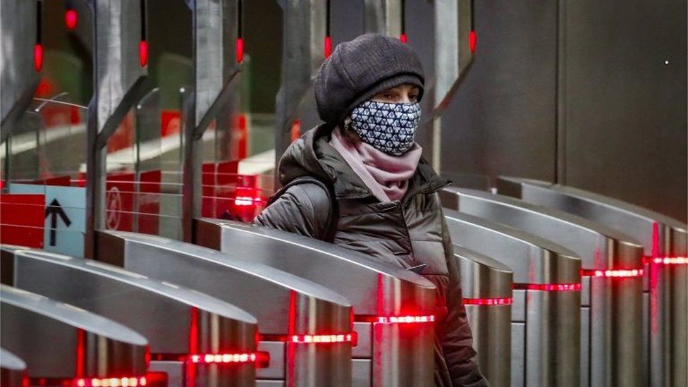 A Russian woman enters a metro station in Moscow (file photo)