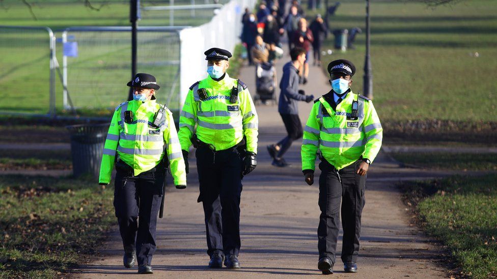 Police officers patrolling Clapham Common in London