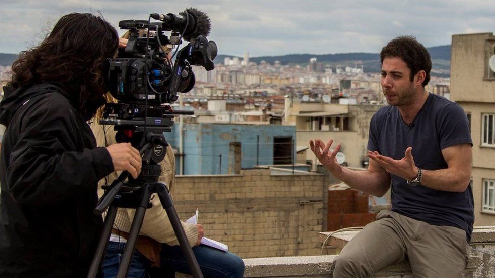 Rami Jarrah speaking to a film crew (2015)