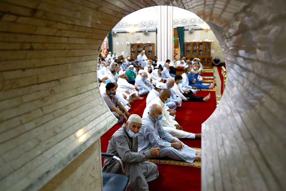 A view of Muslims wearing face masks as they pray at Abu Hanifa an-Numan Mosque in Baghdad, Iraq