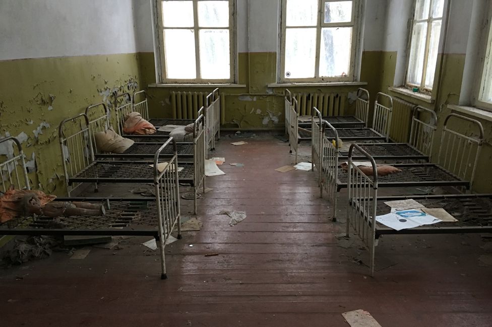 The kindergarten, with dolls on the beds