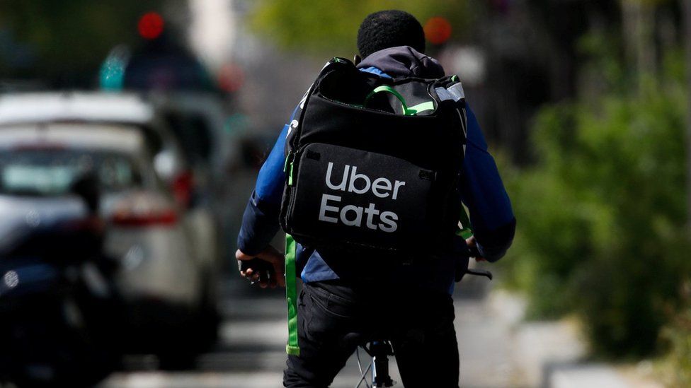A deliveryman for Uber Eats rides a bike in Paris during a lockdown imposed to slow the spread of the coronavirus disease (COVID-19) in France, France, April, 1, 2020.