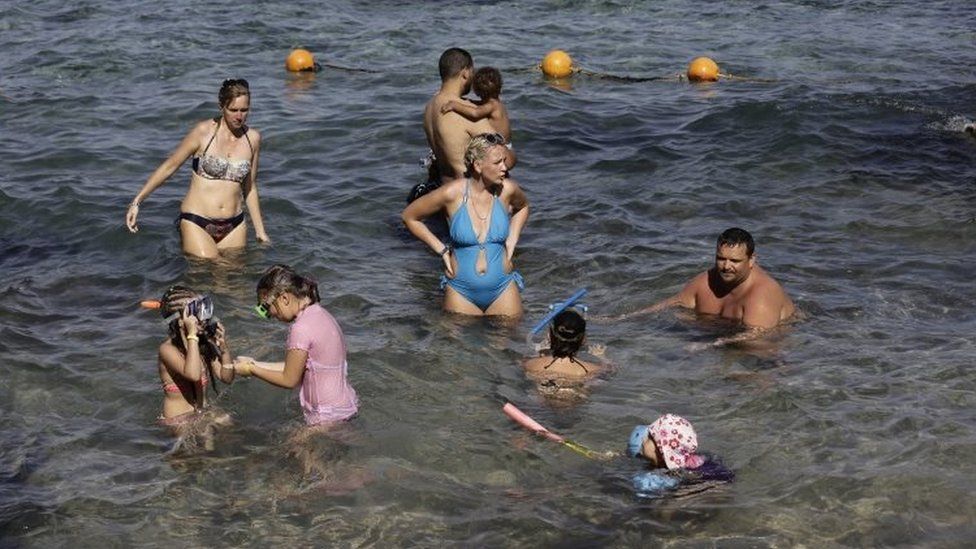 Tourists swim in the sea in Sharm el-Sheikh, Egypt. Photo: 7 November 2015